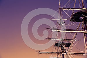 Masting of the big wooden sailing ship. Background