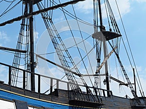 Masts and rigging of a old sailing ship over blue sky