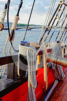 Masts and rigging of an old wooden sailboat. Details deck of the ship