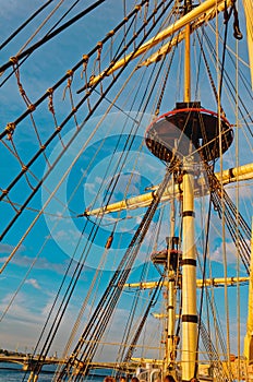 Masts and rigging of an old wooden sailboat. Details deck of the ship