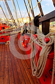 Masts and rigging of an old wooden sailboat. Details deck of the ship