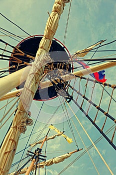 Masts and rigging of an old wooden sailboat. Details deck of the ship