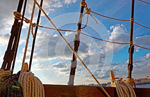 Masts and rigging of an old wooden sailboat. Details deck of the ship