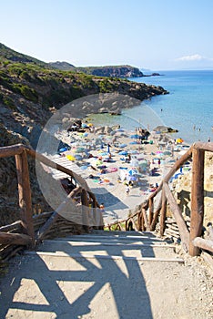 Masua Beach, Italy - August 19: Masua Beach in Nebida crowed in