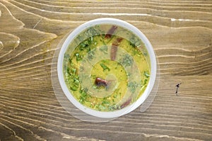 Masur Daal or masoor dal with onion, pepper and salad served in a dish isolated on wooden table top view of indian and bangladesh