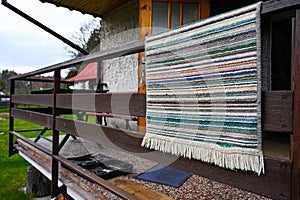 A mat thrown over the rafters at the cottage, preparation for the cottage season, winterizing the cottage