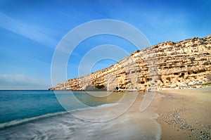 Matala beach with caves on the rocks, Crete, Greece