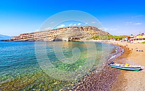 Matala beach with caves on the rocks, Crete, Greece.