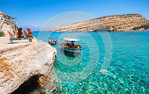 Matala beach with caves on the rocks, Crete, Greece