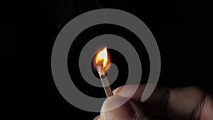 A match stick scratched ignites catches fire in 4x slow motion