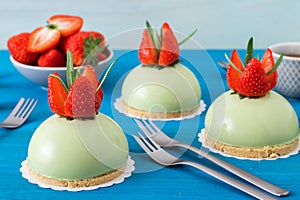 Matcha cheesecake sphere with strawberies