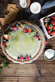 Matcha custard tart topped with fresh berries