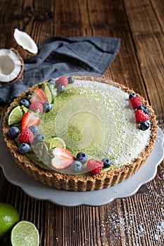 Matcha custard tart topped with fresh berries