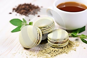 matcha flavor macarons with matcha tea powder around