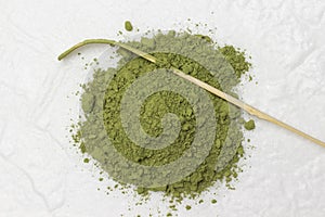 Matcha green powder and bamboo measuring spoon for making matcha green tea