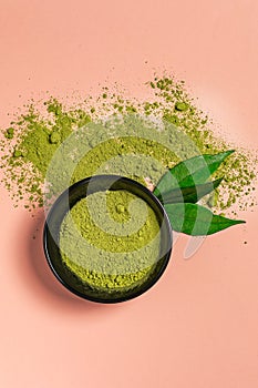 Matcha green tea powder close up on colored background