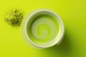 Matcha green tea, a refreshing detoxifier on a green background, top view