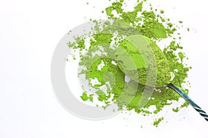 A spoon with powdered matcha green tea, isolated on white background, copy space, top view