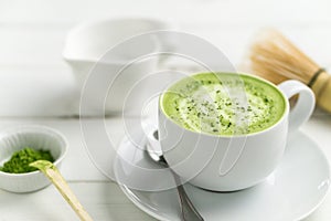 Matcha latte cup close up background blurred. photo