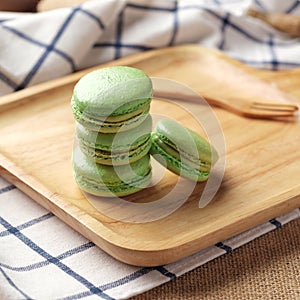 Matcha Macaron on Wooden Plate