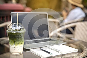 Matcha Milk , Milk Green tea latte on glass table