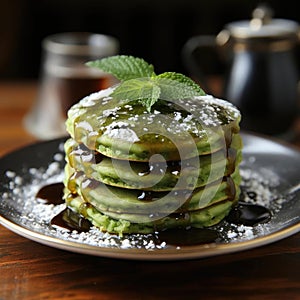 Matcha pancakes with berries and syrup