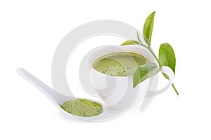matcha powder in White ceramic spoon and Green tea matcha latte