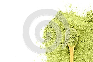 matcha tea green powder with a wooden spoon on a white background with place for text. Prescription facial mask