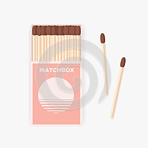 Matchbox of modern design and pair of wooden matches lying beside it isolated on white background. Household flammable