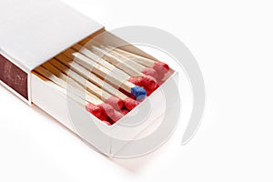 Matchbox with one blue matchstick other in red with clipping path