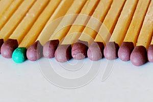 Matches of different colors on a white background