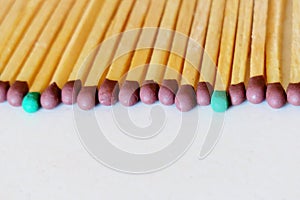 Matches of different colors on a white background