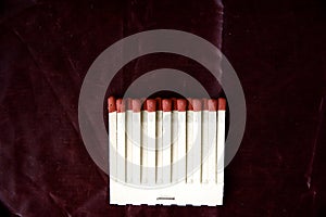 Matches row on deep red background