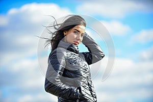Matching style and class with luxury and comfort. Beauty and fashion look. Girl jacket cloudy sky background. Woman