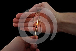 Matchstick fire in a male hands