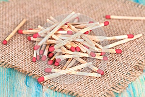 Matchsticks over wooden background