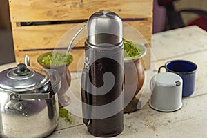 Mate herb Ilex paraguariensis and utensils for preparing mate tea