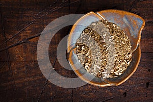 Mate on plate on wooden background