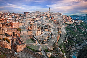 Matera, Basilicata, Italy: landscape at dawn of the old town called Sassi with the ancient cave houses and the creek at the bottom