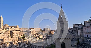 Matera holiday, summer, panorama of historic Matera stone with bell tower under blue sky, European Capital of Culture 2019,