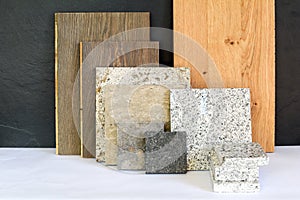 Material collage with natural stone, tiles and wooden parquet floor for renovation of an apartment building