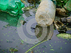 material plastic pollution presented on gutter water, Dirty polluted environment concept