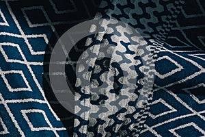 Material textile background. Blue fabric in diamonds. Close-up of the white blue diamond shaped fabric textile texture