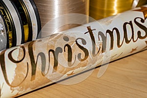 Materials such as wrapping paper and ribbons to pack and decorate Christmas presents