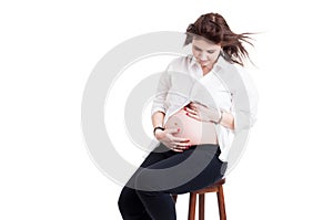 Maternal care concept with beautiful pregnant holding her tummy