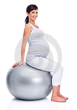 Maternal woman, ball and studio for portrait trimester, wellness and exercise for motherhood. Pregnant female person