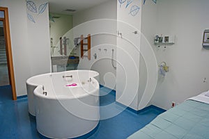 Maternity ward in a hospital with a bath for birth in water