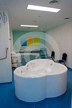 Maternity ward in a hospital with a bath for birth in water