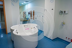 Maternity ward in a hospital with a bath for birth in water