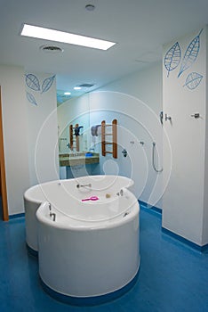 Maternity ward in a hospital with a bath for birth in water